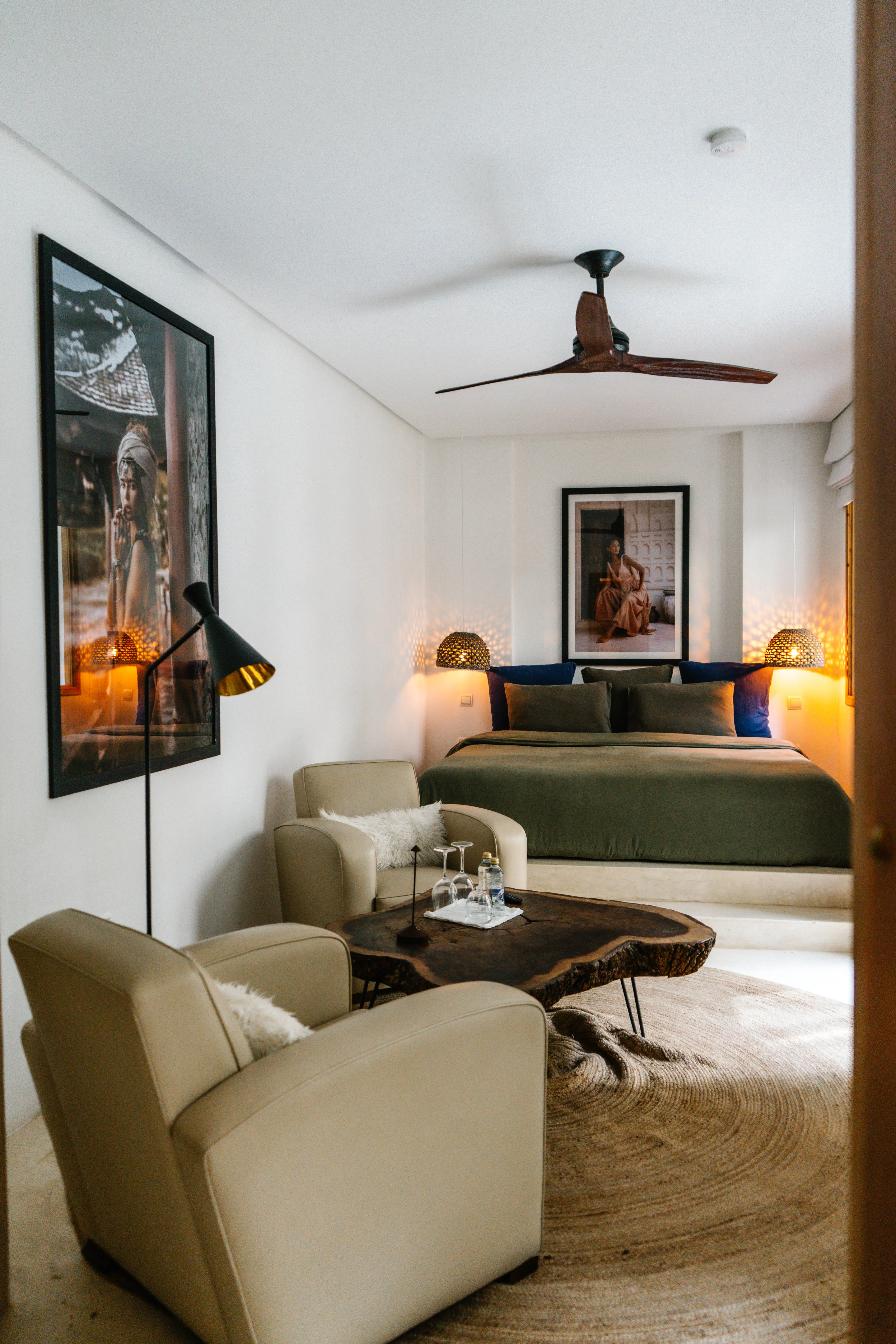 Luxury boutique hotel room featuring a plush bed and sitting area, designed for discerning travelers seeking peace