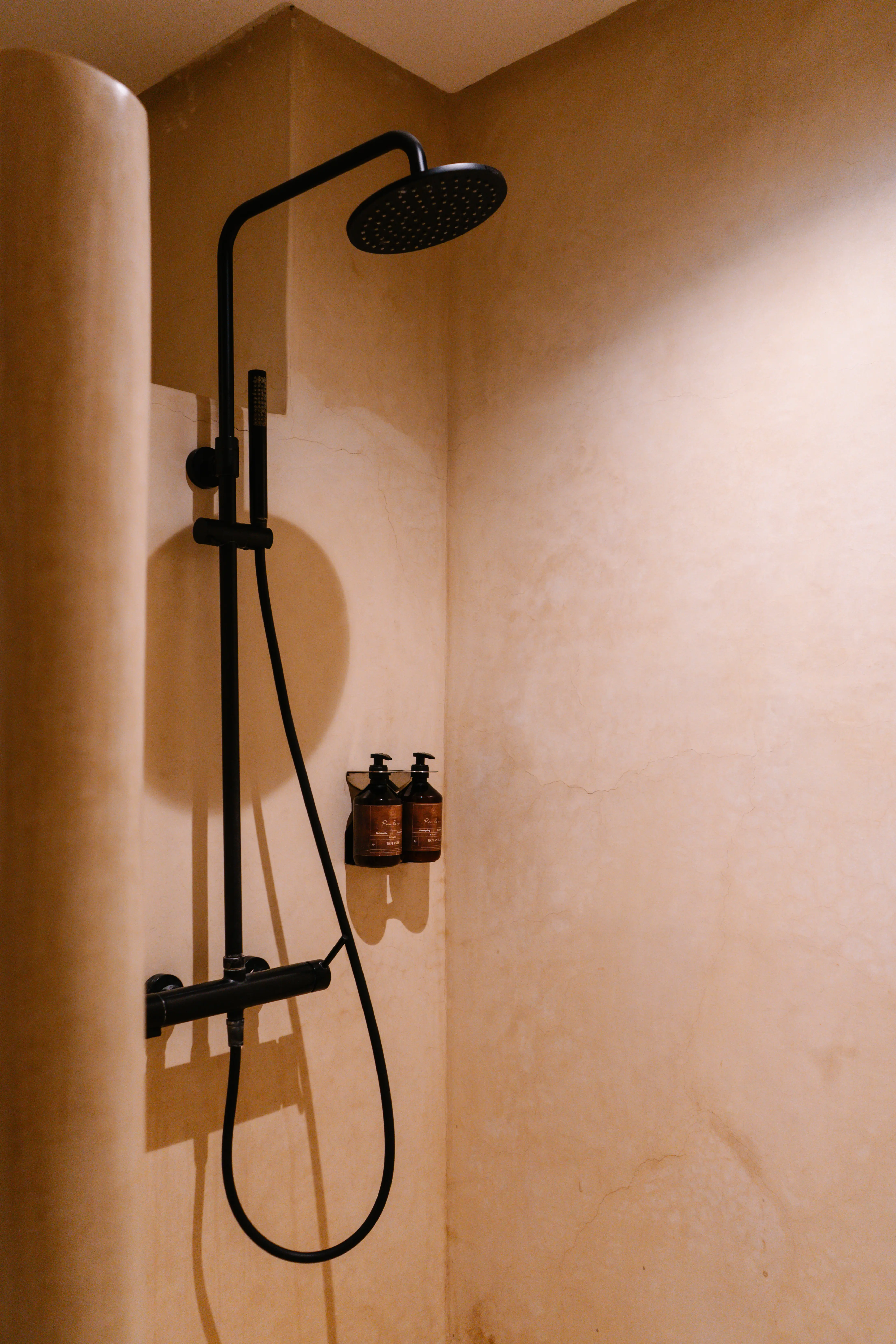 Luxury walk-in shower with high-end amenities and traditional Moroccan design elements