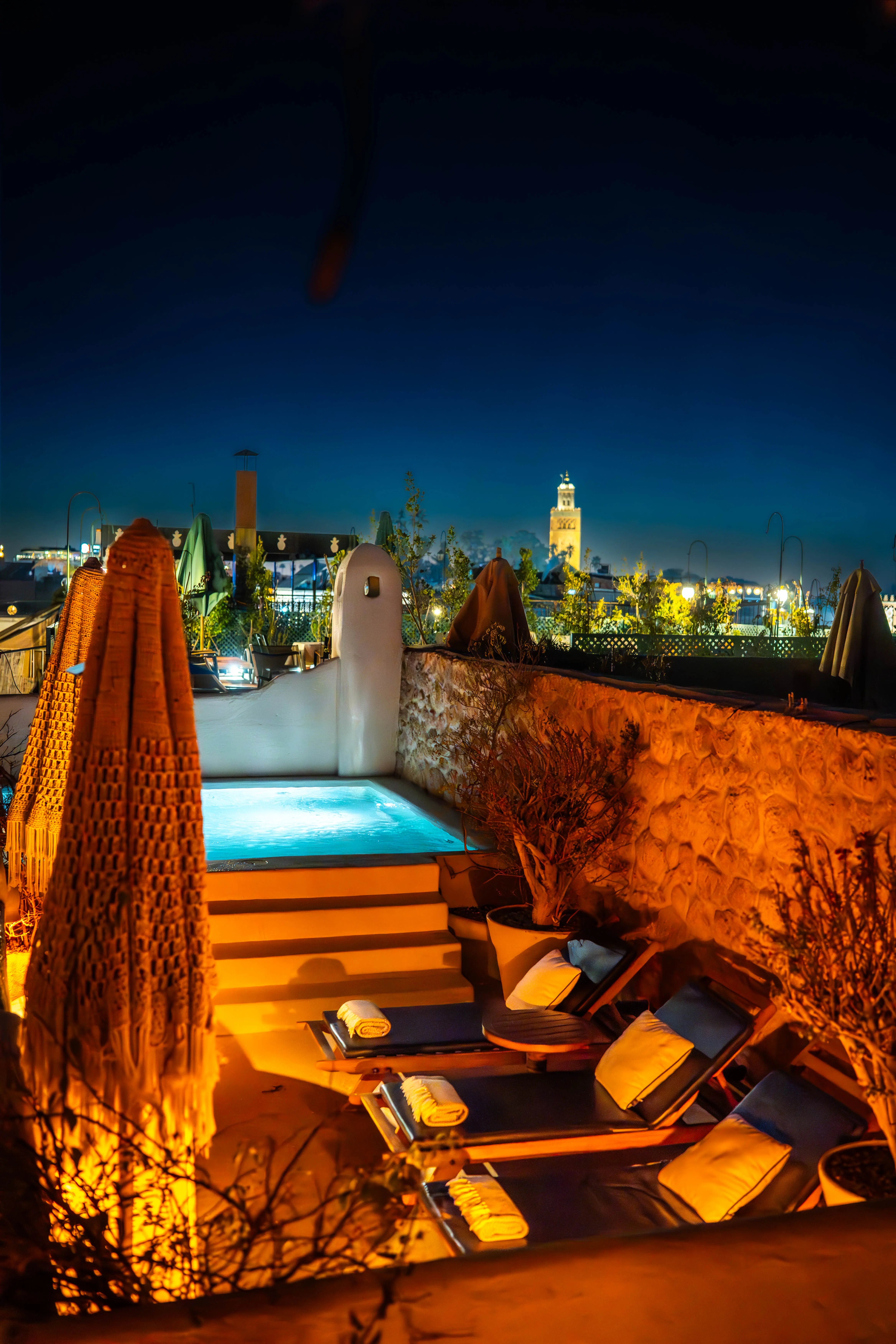 Rooftop terrace with swimming pool and lounge area at Pure House Marrakech
